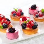 Assorted  fruit tartlets and pieces of cakes for holiday