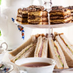 High tea set with dessert. Focus on sandwich